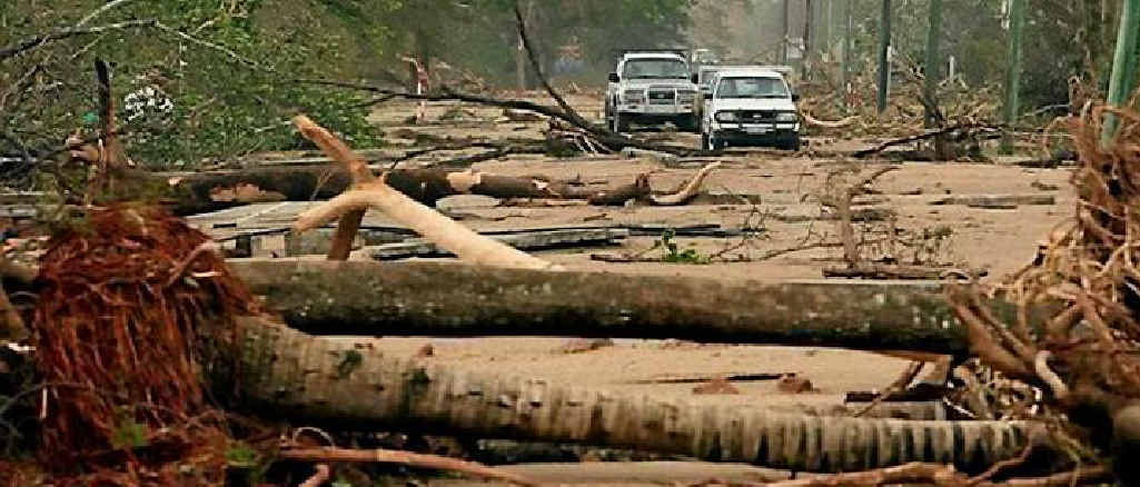 Cardwell’s roads were like a war zone after Cyclone Yasi. Photo: Queensland Reconstruction Authority Cardwell’s roads were like a war zone after Cyclone Yasi. Photo: Queensland Reconstruction Authority